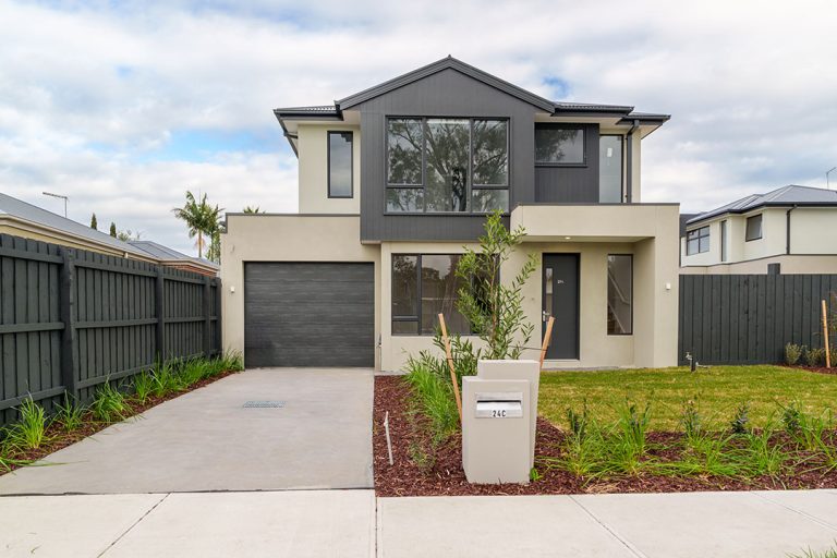 Centenary, Seaford: a house with a driveway and a mailbox