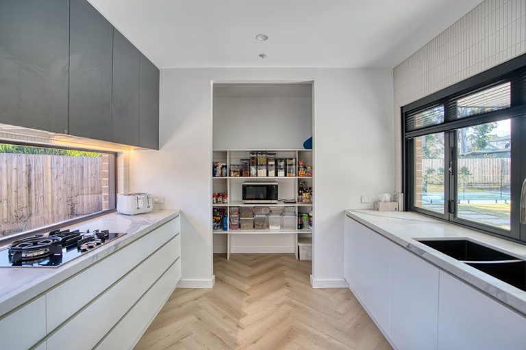 a kitchen with a shelf and a stove