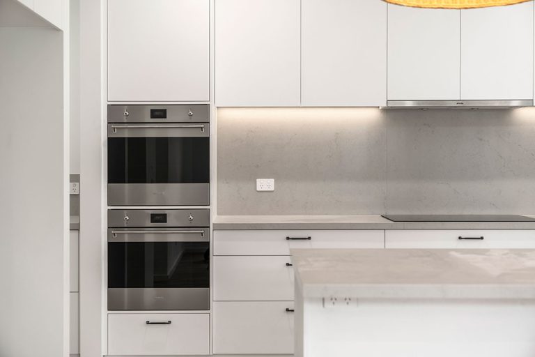 Seaford Road, Seaford: a kitchen with white cabinets and a white countertop