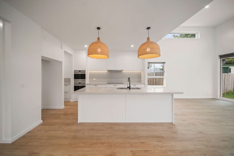 Seaford Road, Seaford: a kitchen with a white island and two lights